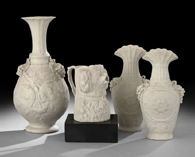 Collection of Four Bennington Parian Ware: Collection of Four Bennington Parian Ware, consisting of a pair of vases with a ruffled mouth decorated with a ten-point star on a reeded background with grape handles, illustrated in Barrett, Benning