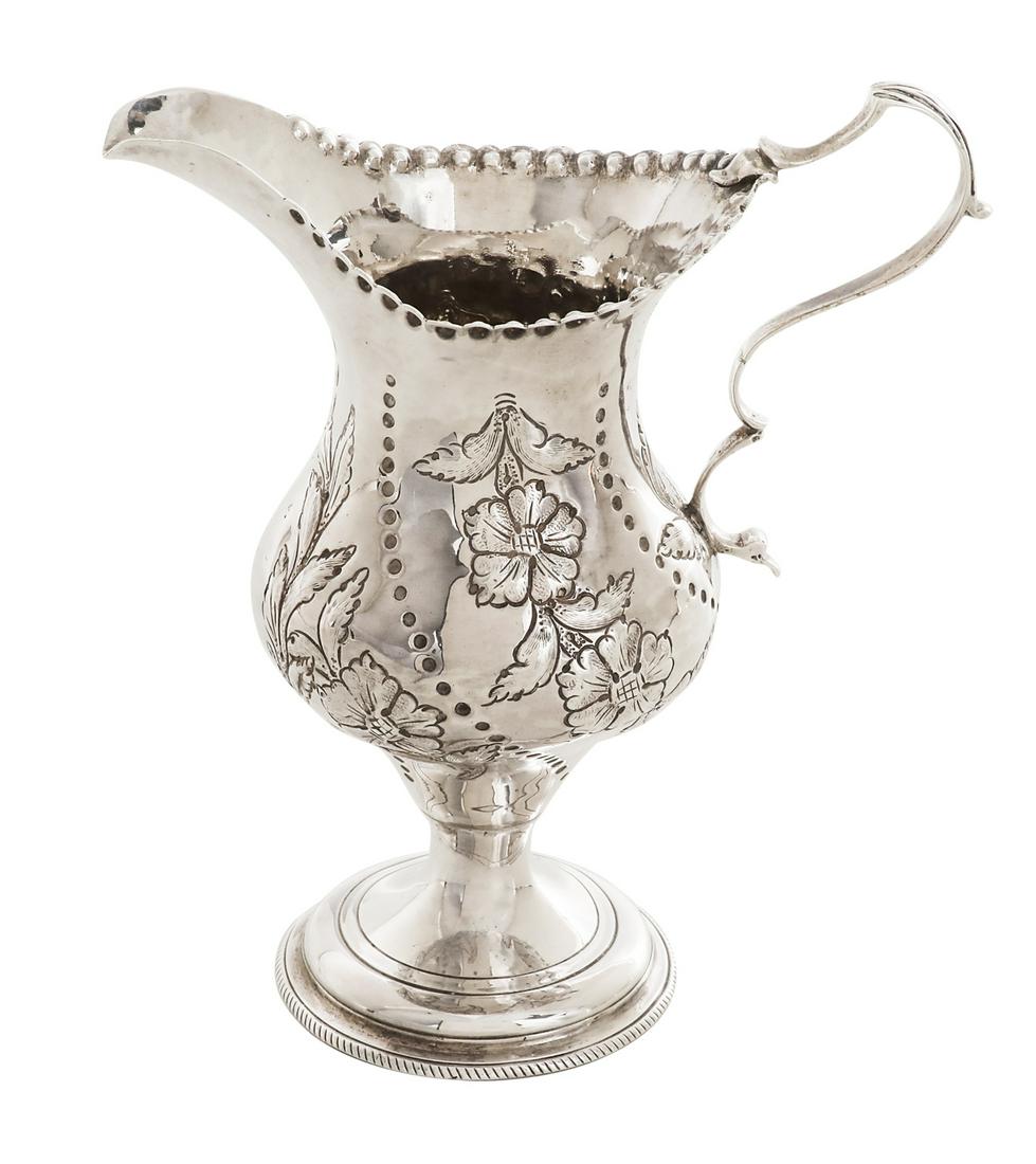 Hester Bateman Sterling Silver Cream Jug: Hester Bateman Sterling Silver Cream Jug hallmarked London, 1783-1784, Bateman's mark overstruck by that of George Gray, of baluster form with domed foot and "S" and "C" scroll handle, with repousse b