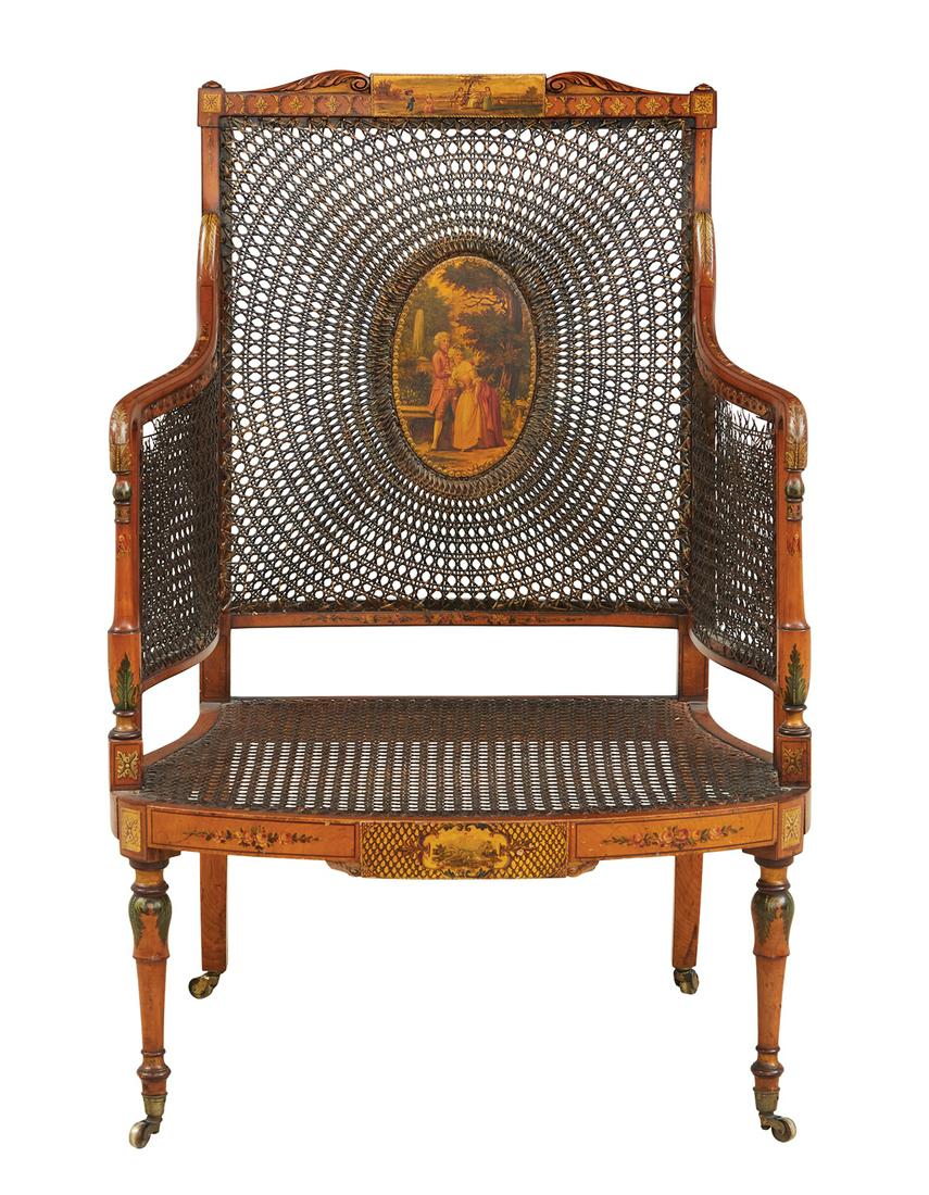 George III-Style Satinwood Armchair: George III-Style Satinwood Armchair early 20th century, in the Adam taste, the caned, rectangular back surmounted by a shaped crest featuring a scene of young children at play, centered by an oval pan