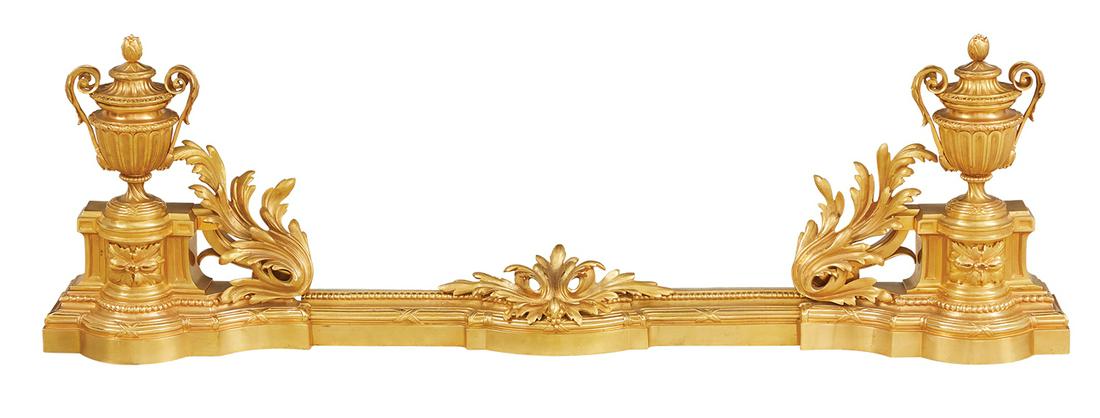 Louis XV-Style Gilt-Bronze Chenets and Fender: Louis XV-Style Gilt-Bronze Chenets and Fender 20th century, French, the fluted urn-form chenets on platforms with ribbon-bound reeding, the matching, integral, beaded fender decorated with large, mold