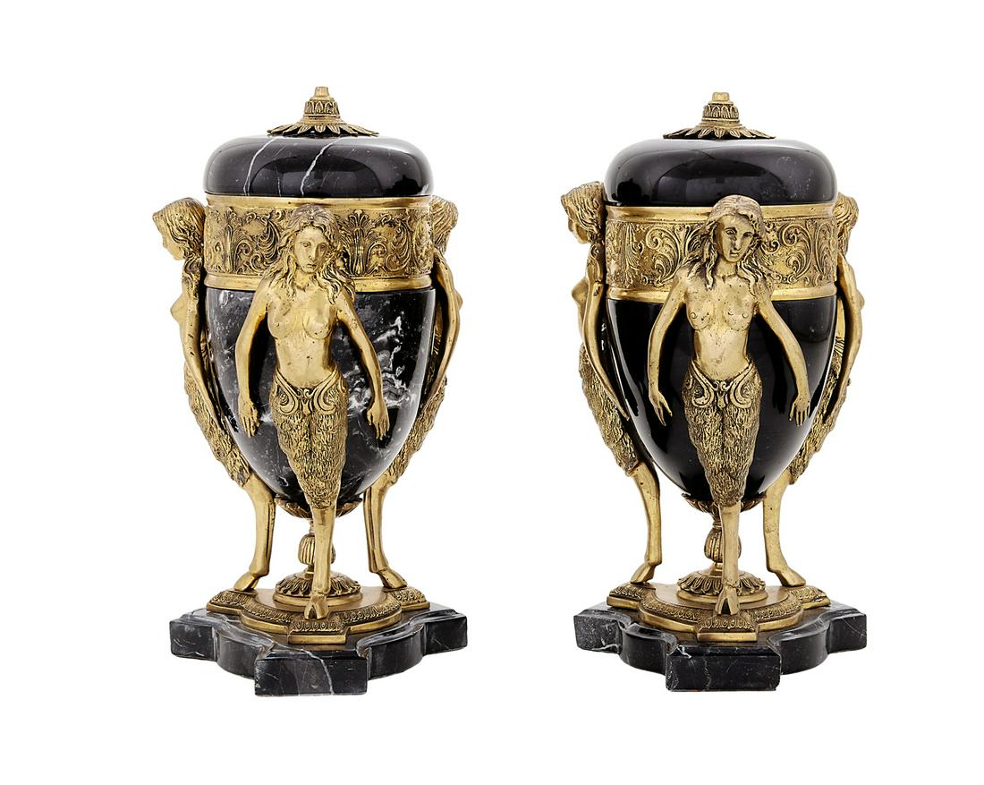 Pair of Bronze-Mounted Marble Garniture Urns: Pair of Bronze-Mounted Marble Garniture Urns 20th century, the white-veined black marble urns supported by molded bronze semi-nude female monopodia on hoof feet, the tripartite marble bases set with m