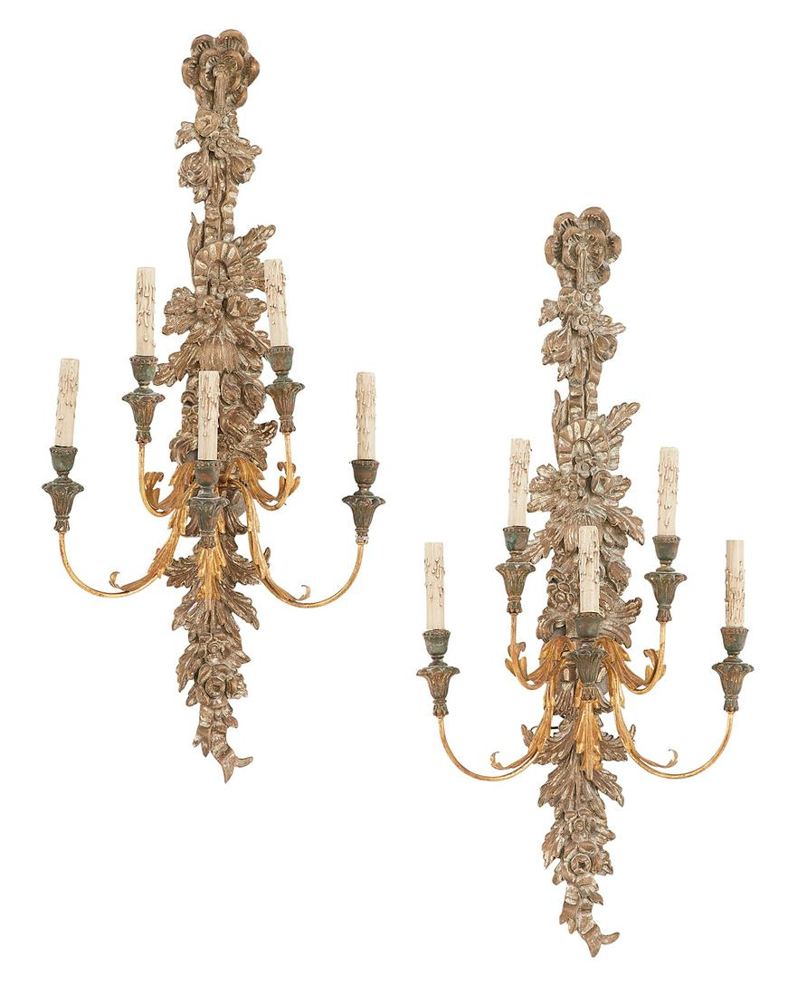 Pair of Italian Wood and Metal Sconces: Pair of Italian Carved and Painted Wood and Parcel-Gilt Metal Sconces third quarter 20th century, in the baroque taste, each backplate with a fruit-carved swag and set with five gilt-metal scrolled ca