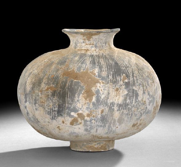 Chinese Unglazed Pottery Cocoon Shaped Vase: Chinese Unglazed Pottery Cocoon Shaped Vase, Han Dynasty (206 BC - 220 AD), the flattened oblong body resting on a short straight foot and having a wide everted lip rim, the gray pottery body with ove