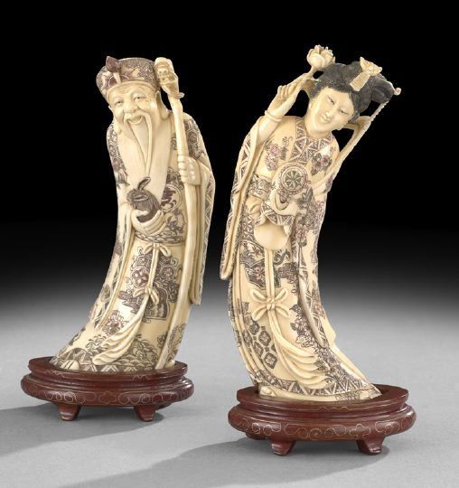 Pair of Chinese Carved Tusks: Pair of Chinese Carved Tusks, depicting a male and female nobleman, both in brocade robes, the male holding a rabbit in one hand, a staff in the other, while the female holds aloft a rose, h. 8".