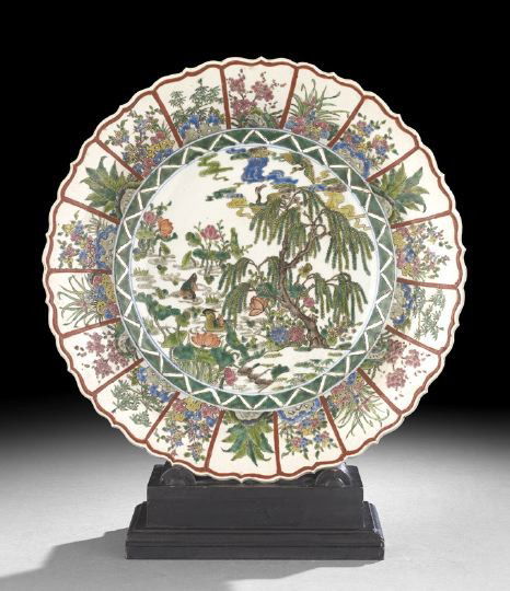 Chinese Famille Verte Porcelain Deep Dish: Chinese Famille Verte Porcelain Deep Dish, the shaped lip above a paneled border with various foliate and floral designs, centering a scene of water fowl in a lush landscape, dia. 17".