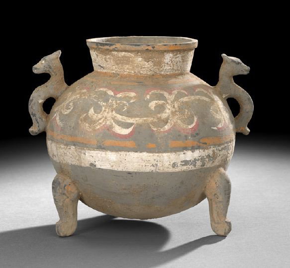 Chinese Painted Pottery Tripod Storage Vessel: Unusual Chinese Painted Pottery Tripod Storage Vessel, Han Dynasty (206 BC-220 AD), the bulbous body resting on three animal form feet, with two stylized dragon handles and slightly flared lip, the bo