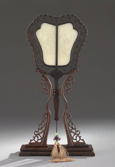 Chinese Zitan and White Jade Ceremonial Fan: Fine Chinese Zitan and White Jade Ceremonial Fan and Stand, 20th century, of conventional shape, the intricately carved zitan body set with two plaques of white jade carved in low relief on the front