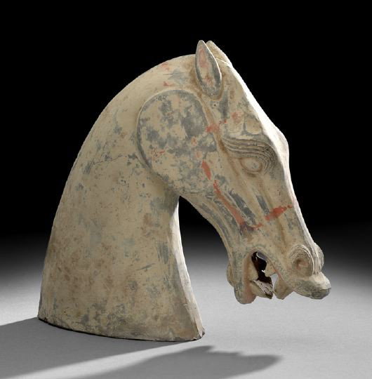 Chinese Painted Pottery Model of a Horse's Head: Chinese Painted Gray Pottery Model of a Horse's Head, Han Dynasty (206 BC-220 AD), the dramatically modeled head posed in an arched position, the ears back with prominent jaw and open mouth showing te
