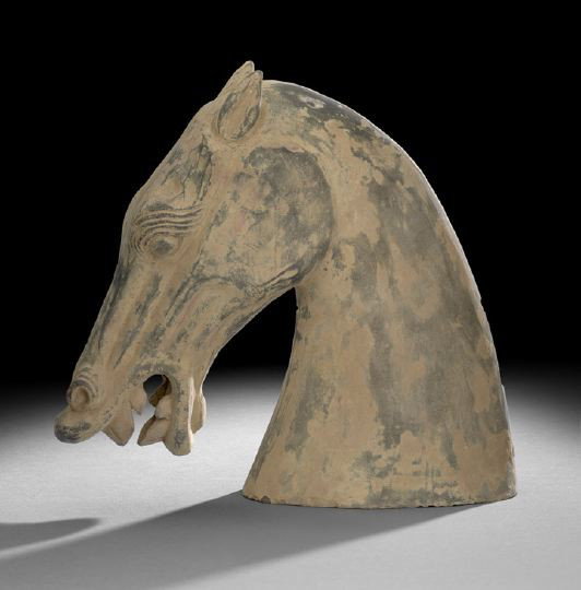 Dramatic Gray Pottery Model of a Horse's Head: Dramatic Gray Pottery Model of a Horse's Head, Han Dynasty (206 BC-220 AD), the strongly modeled head in an arched pose with strong jaw, incised eyebrows, flared nostrils and open mouth revealing its 