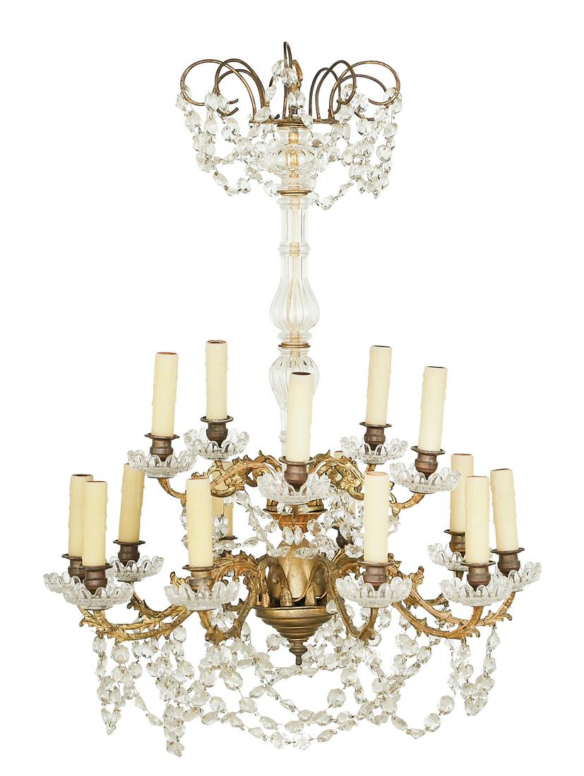 French Bronze and Crystal Chandelier: French Bronze and Crystal Chandelier in the Rococo Taste ca. 1900, the fifteen-light chandelier with a molded glass-clad standard, set with two tiers of molded and pierced rococo candle arms, turned c