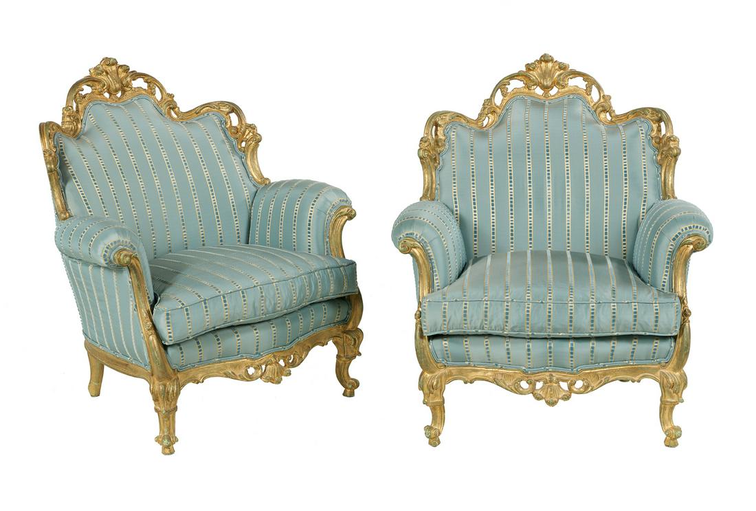 Pair of Giltwood Bergeres in the Louis XV Taste: Pair of Giltwood Bergeres in the Louis XV Taste 20th century, each with a shaped and padded back surmounted by a shell crest, joined by out-scrolled arms to the cushioned seat, raised on foliate-carve