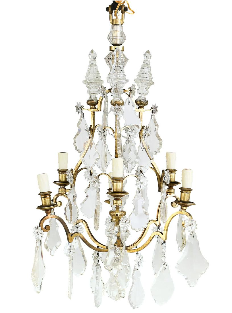 French Gilt-Bronze Chandelier: French Gilt-Bronze Chandelier in the Louis XIV Style second quarter 20th century, the six-light chandelier with a scrolled bronze frame set with turned candle cups and drip pans and hung with large cu