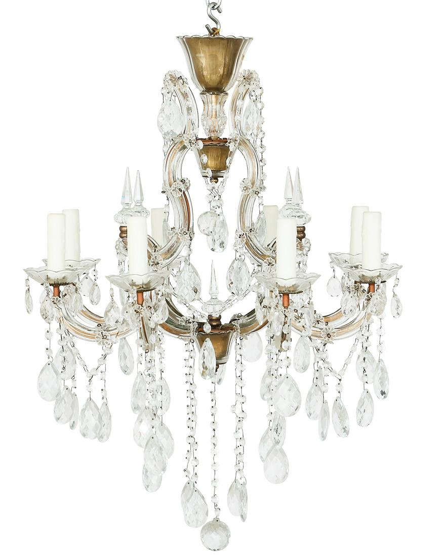 Glass and Gilt-Metal Chandelier: Glass and Gilt-Metal Chandelier in the Maria Theresa Style mid-20th century, the eight-light chandelier with a glass-clad frame and candle arms, the molded glass sockets hung with prisms, the arms set