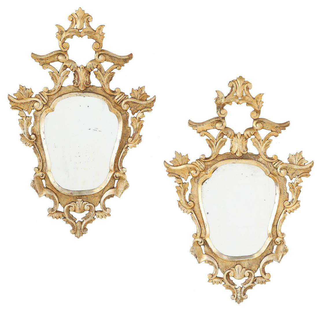 Pair of Italian Giltwood Mirrors: Pair of Italian Giltwood Mirrors ca. 1900, in the Northern Italian rococo taste, framed with giltwood scrollwork and rocaille work, the crest with an opening framed with scrollwork and leaves. h. 30-1
