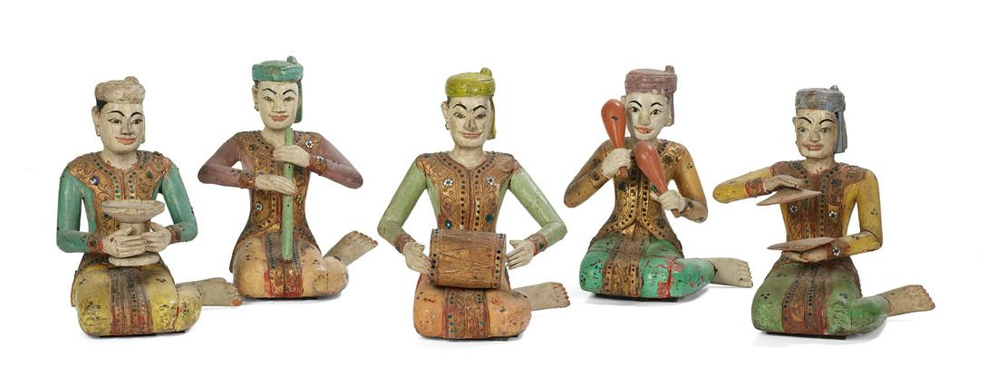 Five Balinese Carved and Painted Wood Musicians: Collection of Five Balinese Carved and Painted Wood Musicians each seated figure with a different instrument and ornamented gilt scrollwork clothing accented with bits of colored mirror glass. h. 14" 