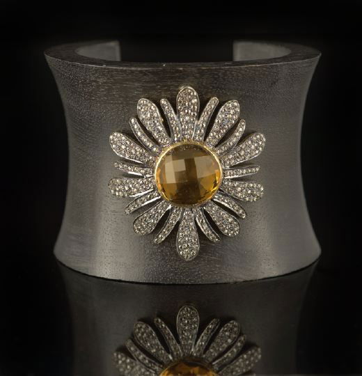 Ebony, Silver, Citrine and Diamond Cuff Bracelet: Unusual Ebony, Sterling Silver, Citrine and Diamond Cuff Bracelet, the solid open cuff slightly waisted and carved from a single piece of ebony, the top set with a "sunflower" centering a "windowpane"