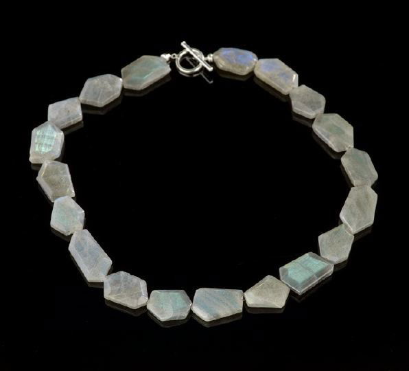 Beautiful Single Strand Labradorite Necklace: Beautiful Single Strand Labradorite Necklace, the polished and faceted free-form stones with a beautiful iridescence from each stone and every angle, finished with a sterling silver toggle clasp.