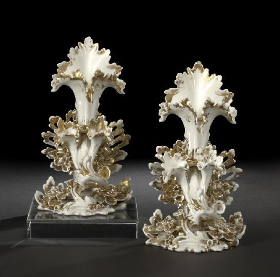 Pair of Paris Porcelain Garniture Vases: Pair of Paris Porcelain White-and-Gold Garniture Vases, third quarter 19th century, modeled as a central trumpet fronted by a tangent pair of trumpet-form posy vases, h. 11", w. 6-1/2", d. 5".