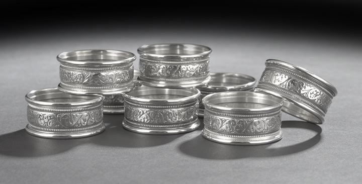 Eight American Sterling Silver Napkin Rings: Set of Eight American Sterling Silver Napkin Rings, first quarter 20th century, by the Alvin Corp., Providence, Rhode Island, each narrow ring decorated with an engraved band of rococo scrolls flanked