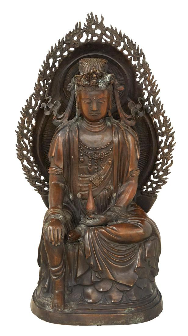 Bronze Figure of a Seated Guanyin: Bronze Figure of a Seated Guanyin 20th century, the Goddess of Compassion holding her sacred water bottle, with a pierced halo at her back. h. 32", w. 18", d. 11-3/4" Provenance: Estate of Norma Crawf