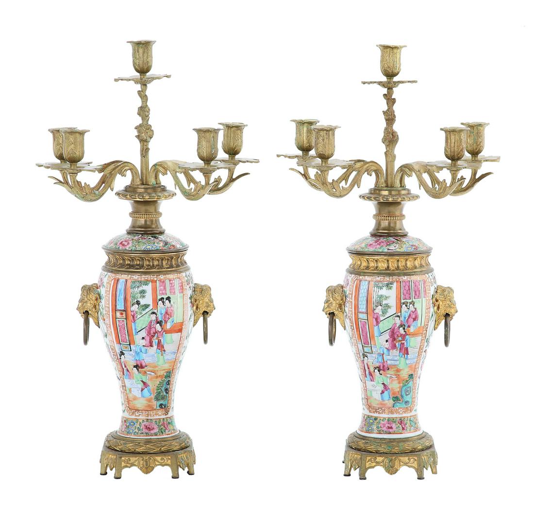 Pair of Gilt-Bronze and Rose Canton Candelabra: Pair of Franco-Chinese Gilt-Bronze and Rose Canton Candelabra fourth quarter 19th century, the porcelain bases decorated with panels of mandarin figures and mounted with lion's-head ring pulls, set wi