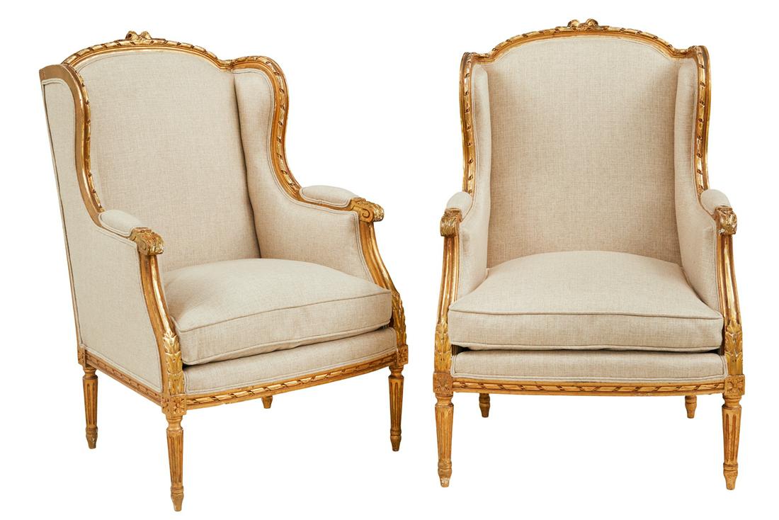 Pair of Louis XVI-Style Bergeres avec Oreilles: Pair of Louis XVI-Style Giltwood Bergeres avec Oreilles 20th century, each with a slightly domed and padded back surmounted by a floral crest, joined by shaped and padded arms to the cushioned seat, r