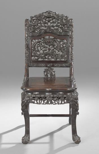 Southeast Asian Rosewood Sidechair: Southeast Asian Rosewood Sidechair, early 20th century, the pierced and heavily carved back featuring dragon and cloud patterns, the banded wooden seat above a carved apron and raised on paneled squar