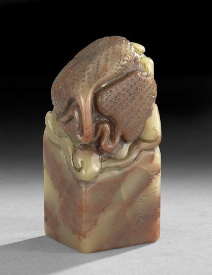 Unusual Chinese Carved Soapstone Seal: Unusual Chinese Carved Soapstone Seal, 19th century, of squared rectangular form with the top carved as two flattened sea rays among waves at the top, the stone a mottled green and brown, an engraved 