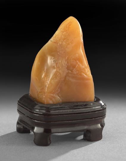 Chinese Shoushan Stone Scholar's Mountain: Good Chinese Shoushan Stone Miniature Scholar's Mountain, 19th century, the bright orange-colored stone in the shape of a single mountain peak carved with delicate low relief decoration of two seated 