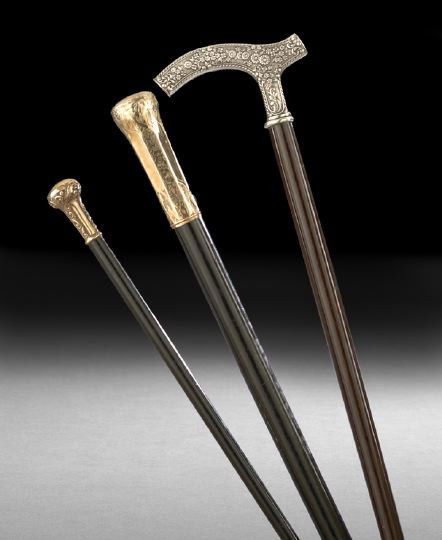 Three Gold and Silver Plated Walking Sticks: Group of Three Gold and Silver Plated Walking Sticks, late 19th century, including two with gold plated handgrips and finely chased details, together with a silver-plated example in floral repousse de