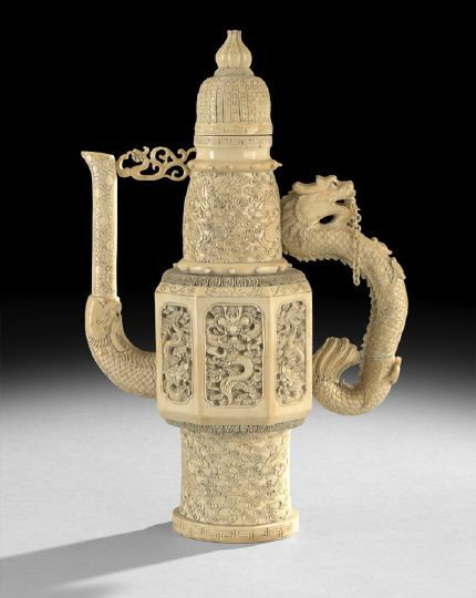 Chinese Carved Ivory Model of a Wine Ewer: Chinese Carved Ivory Model of a Wine Ewer, first half 20th century, composed of a hexagonal body with tubular base, dragon handle, dragon spout, beehive shaped neck and domed cover, carved in intricat