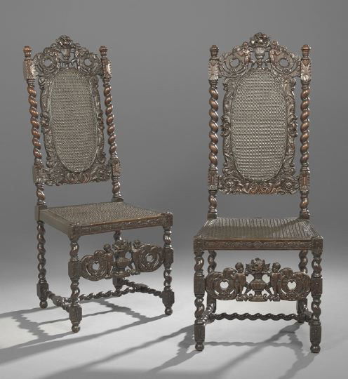 Pair of Carolean-Style Fruitwood Sidechairs: Pair of English Carolean-Style Stained Fruitwood Sidechairs, 19th century, each with an oval caned back surmounted by a crest of putti flanking a fruit basket and flanked by barley twist uprights abov