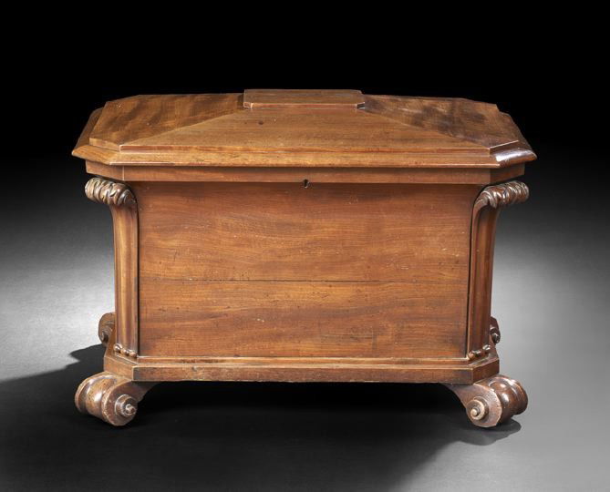 William IV Mahogany Cellarette: William IV Mahogany Cellarette, second quarter 19th century, of sarcophagus form, the stepped-top opening to a velvet-lined interior, the canted corners headed by acanthus leaves, on well-scrolled fee