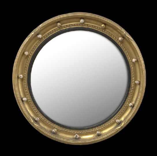 Diminutive Convex Giltwood Looking Glass: Diminutive Convex Giltwood Looking Glass, fourth quarter 19th century, the round shadowbox frame with an ebonized liner and fitted with sixteen turned round balls, dia. 16".
