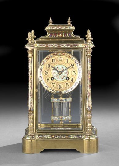 French Champleve Enamel Mantel Clock: French Champleve Enamel Mantel Clock, first quarter 20th century, the brass base, trimmed in polychrome enamels and set with turreted corners, columns with lower portions engine-turned and upper porti