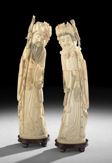 Pair of Chinese Carved Ivory Figures of Deities: Pair of Chinese Carved Ivory Figures of Deities, 20th century, each carved following the curve of the tusk, both figures wearing lotus leaf hats, the male with a fishing pole and basket, the female wi
