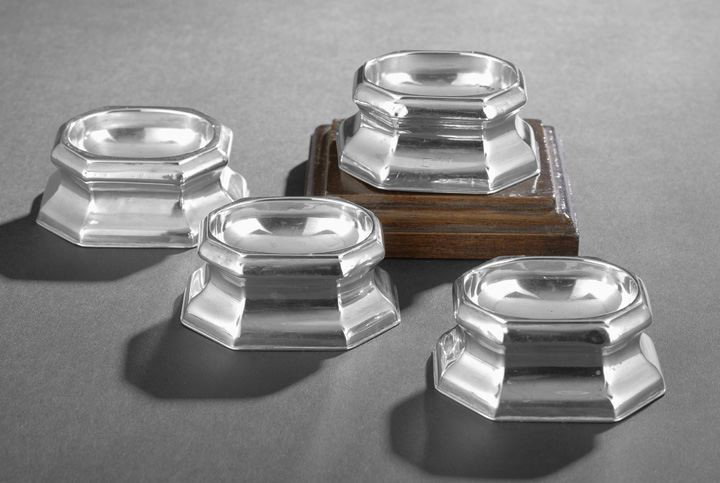 Four George II Sterling Silver Trencher Salts: Assembled Set of Four George II Sterling Silver Trencher Salts, hallmarked 1727-1732, three by Edward Wood (d. 1752), the other with rubbed mark (John Jones?), each of elongated octagonal form with wa