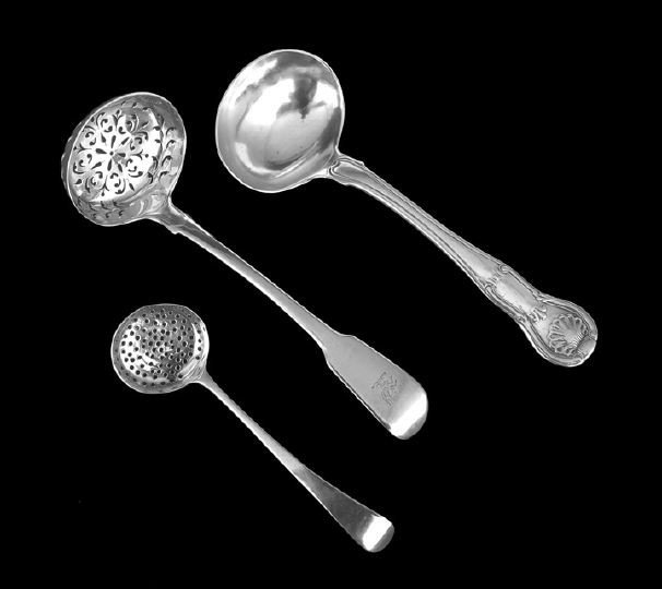 Three George III Sterling Silver Serving Pieces: Three George III Sterling Silver Serving Pieces, including a small "Old English" pattern church strainer spoon hallmarked London, 1790-1791, by William Sumner I, l. 5", a large "Fiddle" pattern sugar 
