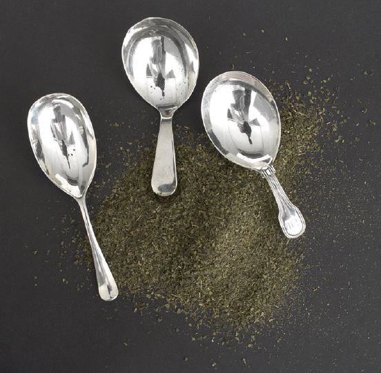 Three 19th Century English Caddy Spoons: Three 19th Century English Caddy Spoons, including a George III "Fiddle Thread" example, hallmarked London, 1801-1802, by George Nangle, monogrammed "EM", l. 3-1/8", a George IV "Old English" example,