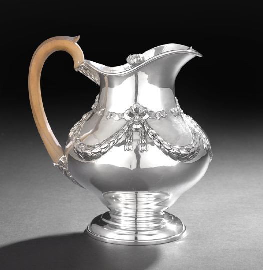 George IV Sterling Silver Hot Water Jug: George IV Sterling Silver Hot Water Jug, hallmarked London, 1823-24, by Benjamin Smith III, the pear-shaped body decorated with repousee laurel swags centering an oval cartouche, with shaped rim, beak