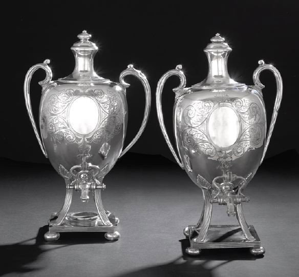 Pair of Edwardian Silverplate Hot Water Urns: Pair of Edwardian Silverplate Hot Water Urns, ca. 1900, by Hamilton, Laidlaw & Co., Sheffield, each of ovoid form, with crested "C-scroll" handles, waisted lid with toupie finial, and raised on four a