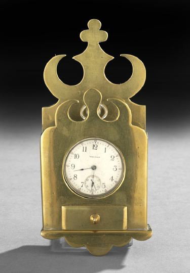 Continental Brass Hanging Watch Hutch: Continental Brass Hanging Watch Hutch, mid-19th century, the bold cut-out cornice at wall level echoed by a small front cornice, the lower edge featuring a small drawer to hold a watch key over a scal