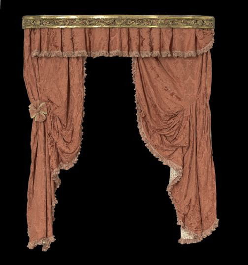French Giltwood Cornice: French Giltwood Cornice, late 19th century, of serpentine form with a pierced foliate and shell-carved central band within an annulated frame, hung with "Titian Red" Scalamandre silk damask lined with