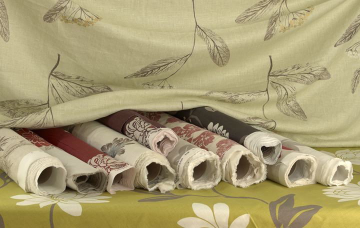 12 Rolls of Cotton & Cotton Blend Floral Fabric: Twelve Rolls of Assorted Cotton and Cotton Blend Floral Designed Fabric, including a cotton Harlequin Fabrics tan and rose floral design in the "Aviary" pattern, w. 54", l. 3-1/2 yds., pattern repeat 