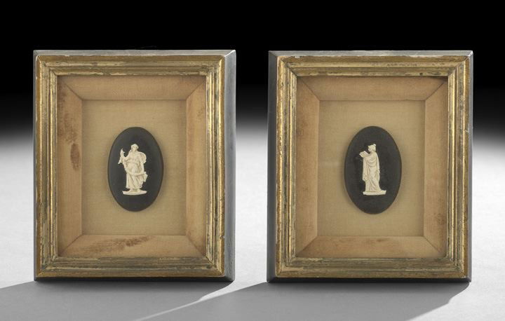 Pair of Composition Classical Figures: Pair of Composition Classical Figures, early 20th century, both mounted against a black oval medallion and set within a gilded and ebonized shadow box frame, h. 7", w. 6".