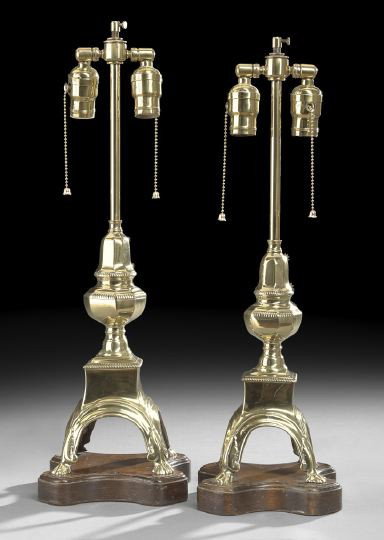 Pair of Georgian-Style Andirons Mounted as Lamps: Pair of Georgian-Style Andirons Now Mounted as Lamps, first quarter 20th century, round faceted finials trimmed with reeded edges, resting on square plinths supported by arched paw feet, now on mahoga