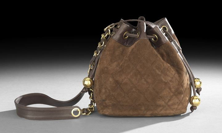 Chanel Brown Quilted Suede and Kidskin Bag: Chanel, Paris, Chocolate Brown Quilted Suede and Kidskin Drawstring Bag, the drawstrings ended in "quilted" gold balls marked with interlocking "C's", the side with a vertical zippered pocket, the zip