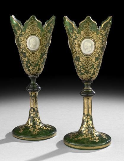 Pair of Bohemian Chalice-Form Vases: Pair of Bohemian Chalice-Form Vases, the emerald green glass decorated on the trumpet foot with gilt ivy leaves, and the vessels with crenelated rims decorated with applied sulphide profile portraits 