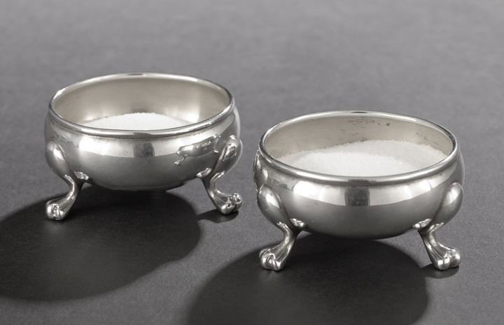Pair of American Sterling Silver Salt Cellars: Pair of American Sterling Silver Salt Cellars, 1929-1933, by Tuttle Silversmiths, Boston, Massachusetts, each of bulbous circular form, with molded tim and raised on three pad feet, the interiors gilt