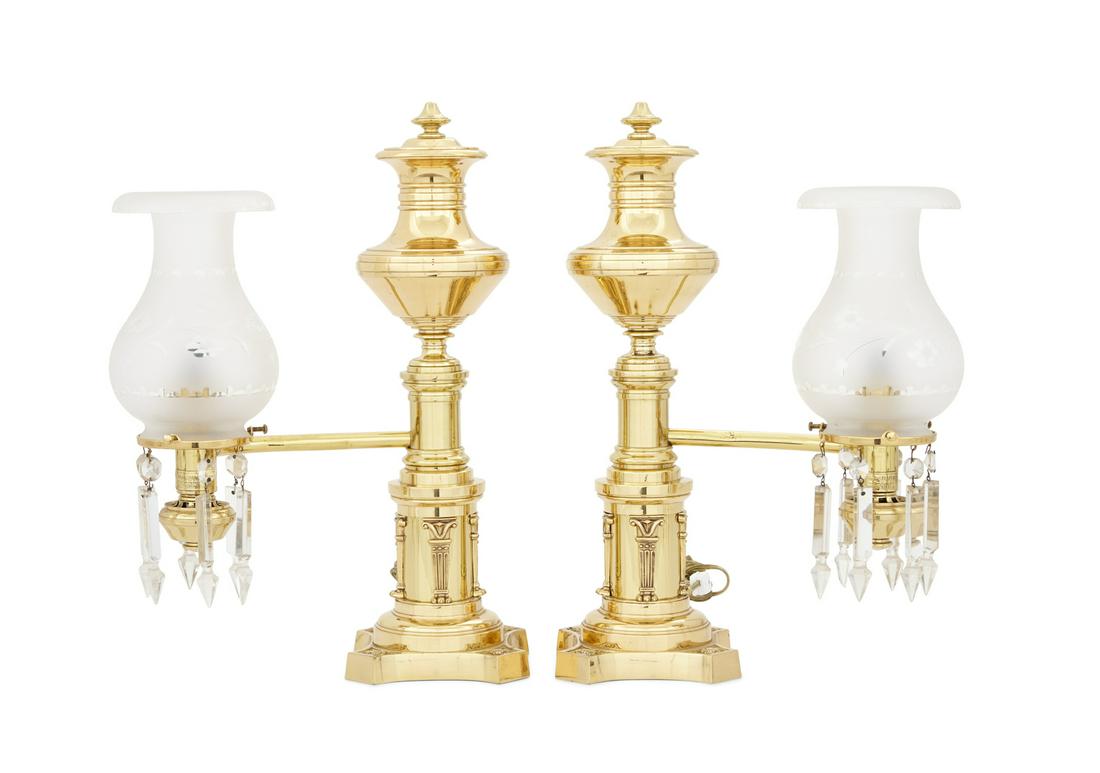Pair of English Polished Bronze Argand Lamps: Pair of English Polished Bronze Argand Lamps second quarter 19th century, the urn-form tanks on coved bases with molded monopodia and corner medallions, mounted with spear-cut prisms and frosted and c